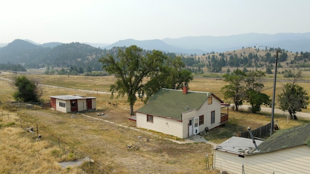 drone / aerial view with a mountain view and a rural view