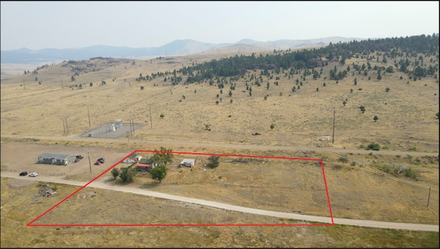 bird's eye view featuring a rural view and a mountain view