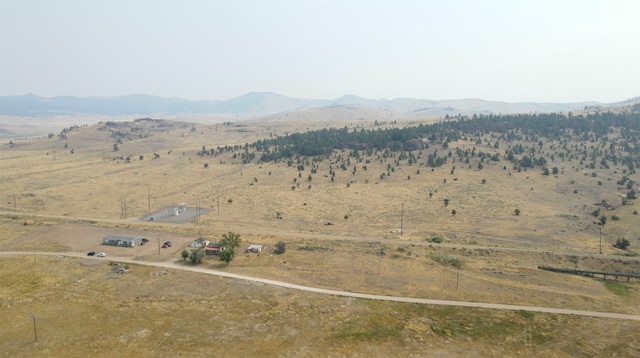 drone / aerial view featuring a rural view and a mountain view