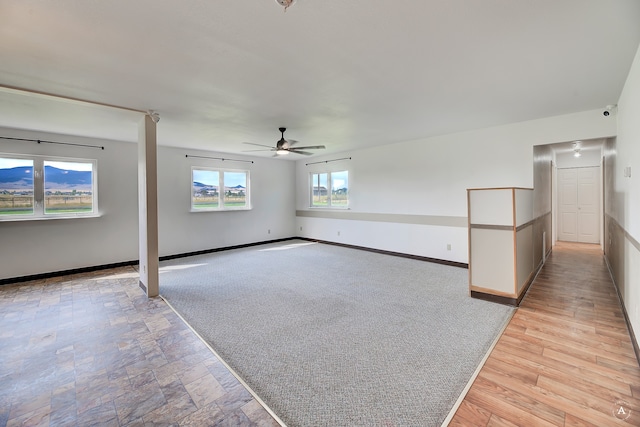 unfurnished room featuring ceiling fan and light hardwood / wood-style floors