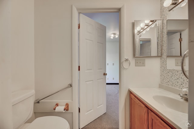 bathroom featuring vanity and toilet