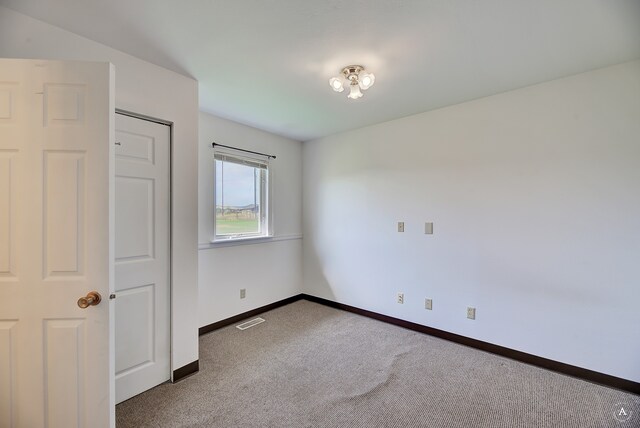 unfurnished bedroom featuring carpet