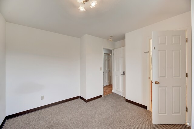 unfurnished bedroom featuring carpet