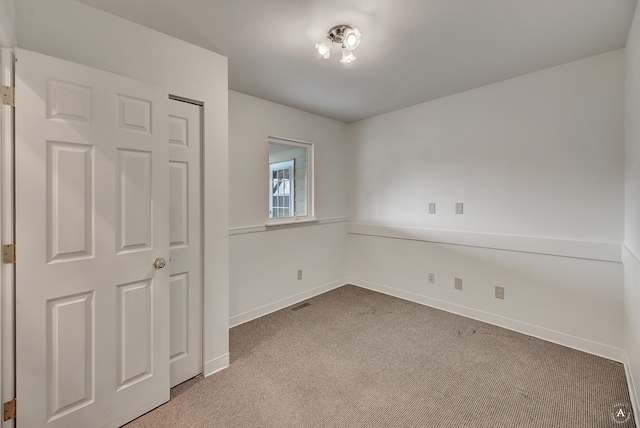 unfurnished bedroom featuring carpet floors