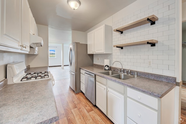 kitchen with white stove, white cabinetry, stainless steel dishwasher, extractor fan, and light hardwood / wood-style floors