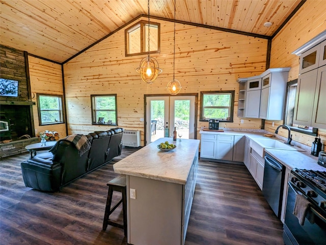 kitchen featuring a kitchen island, high vaulted ceiling, and hanging light fixtures