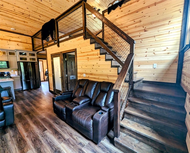 living room with wood ceiling, high vaulted ceiling, dark hardwood / wood-style floors, and wooden walls