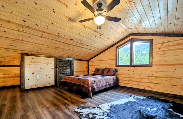 bedroom featuring wood walls, wood-type flooring, ceiling fan, wooden ceiling, and vaulted ceiling