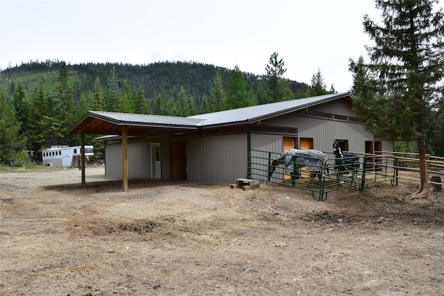 view of stable featuring a mountain view