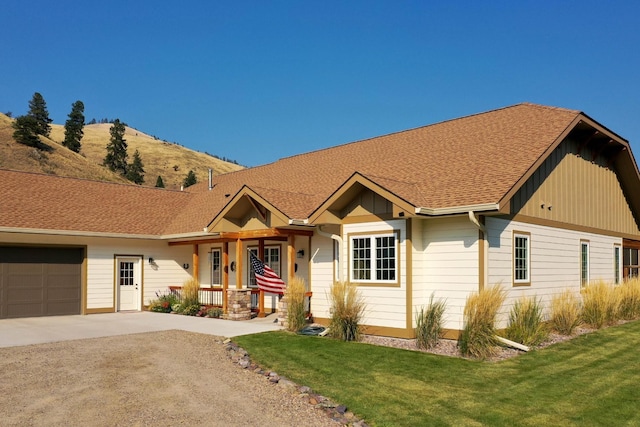 view of front of property with a garage and a front yard