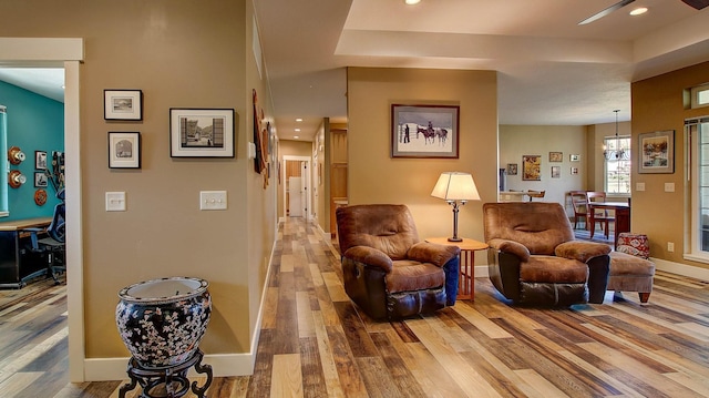 sitting room with wood-type flooring