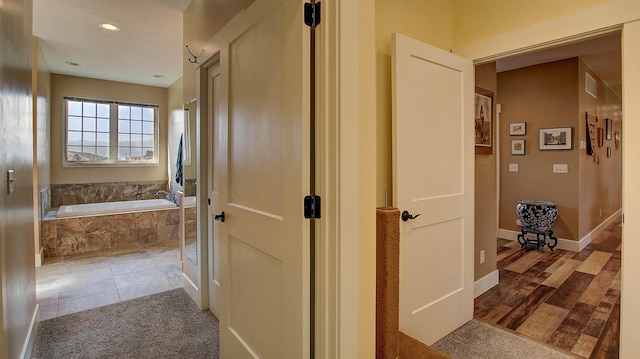 corridor with tile patterned flooring