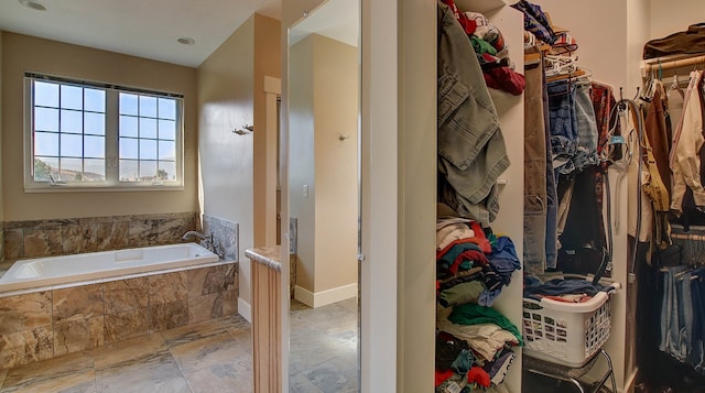 bathroom featuring tiled bath