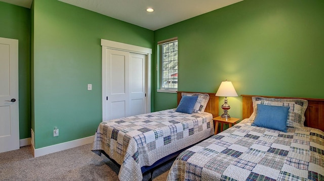 carpeted bedroom with a closet