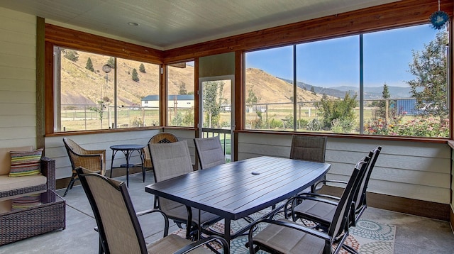 sunroom with a mountain view