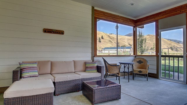 sunroom / solarium with a mountain view