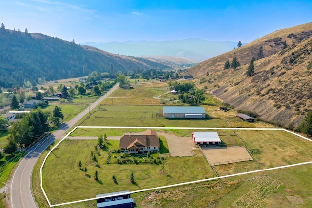 aerial view featuring a mountain view and a rural view