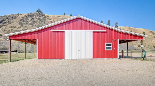 view of outbuilding with a mountain view