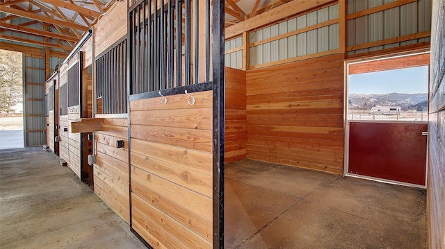 view of horse barn featuring a mountain view