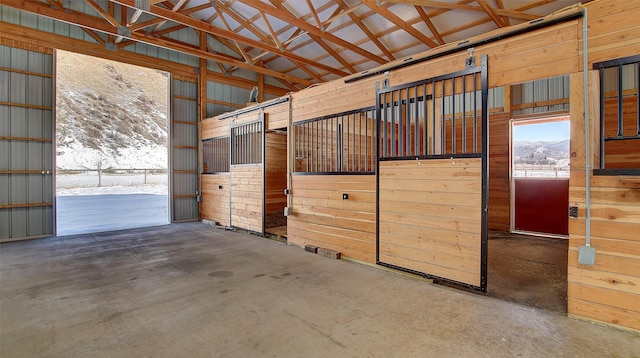 view of horse barn featuring a mountain view