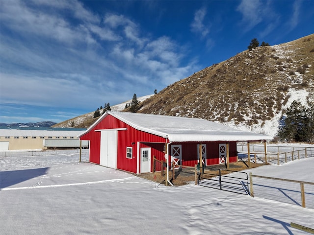 view of stable featuring a mountain view