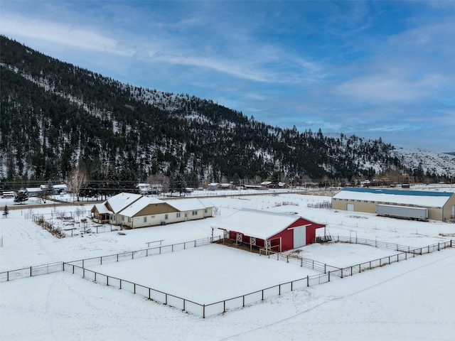 snowy aerial view with a mountain view