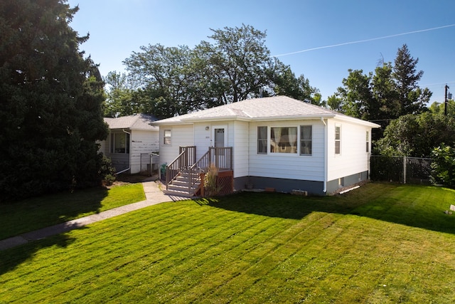 bungalow-style home with a front lawn