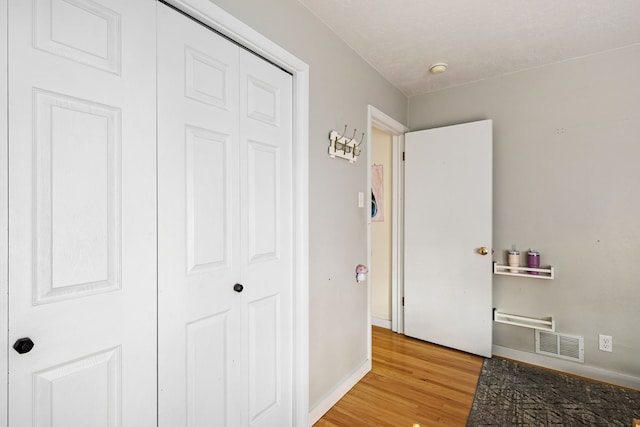 hallway with light wood-type flooring