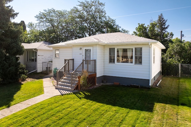 bungalow-style house with a front yard