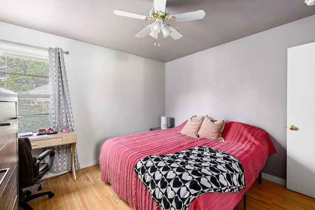 bedroom featuring ceiling fan and light hardwood / wood-style floors