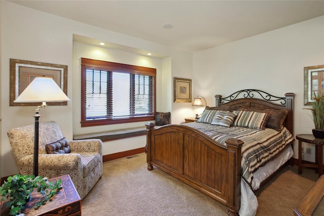 bedroom with light colored carpet, recessed lighting, and baseboards