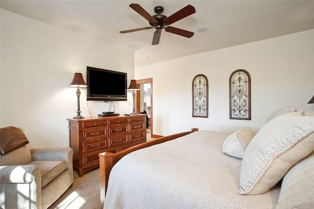 bedroom with a ceiling fan and light colored carpet