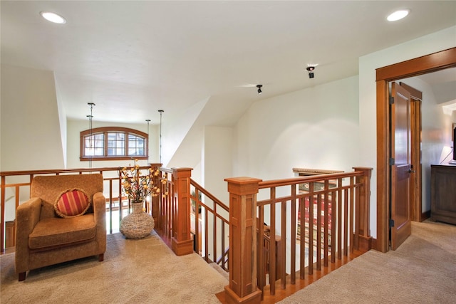 hall with recessed lighting, carpet, and an upstairs landing