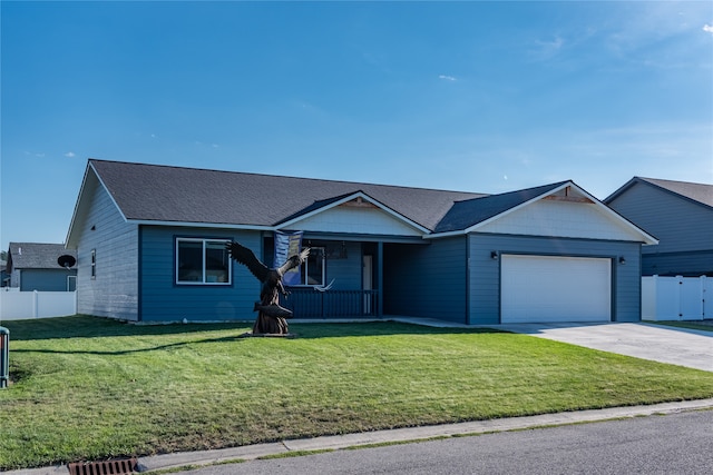 single story home with a garage and a front lawn