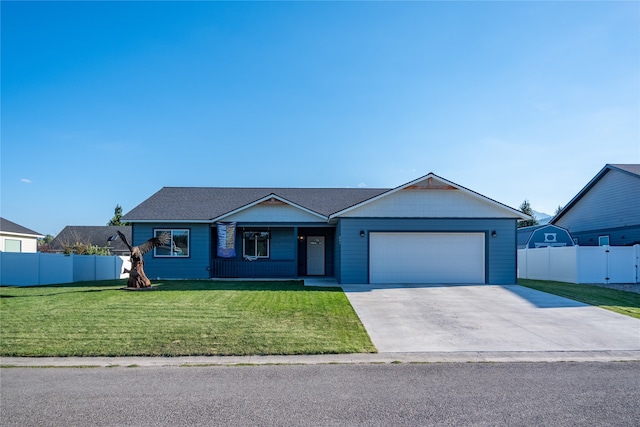 single story home with a front yard and a garage