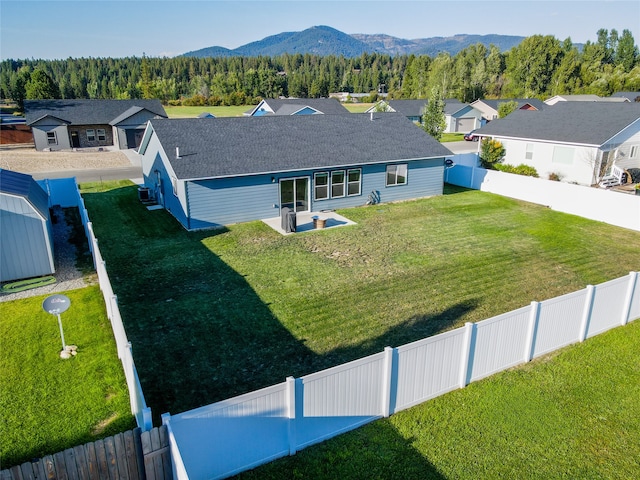 birds eye view of property with a mountain view