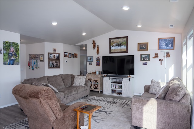 living room with vaulted ceiling and hardwood / wood-style flooring