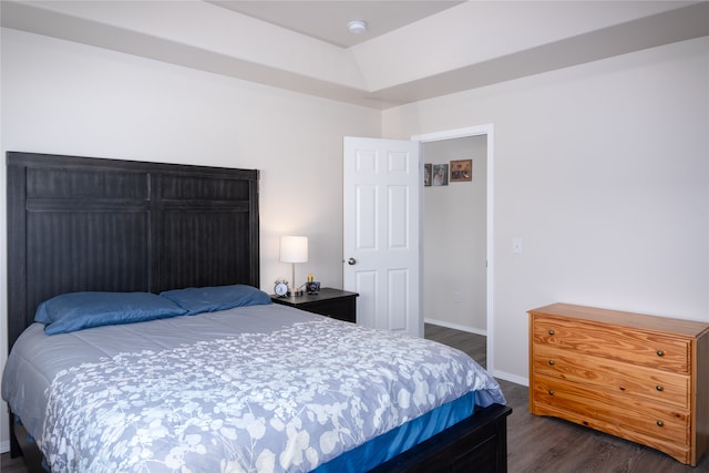 bedroom featuring dark hardwood / wood-style flooring