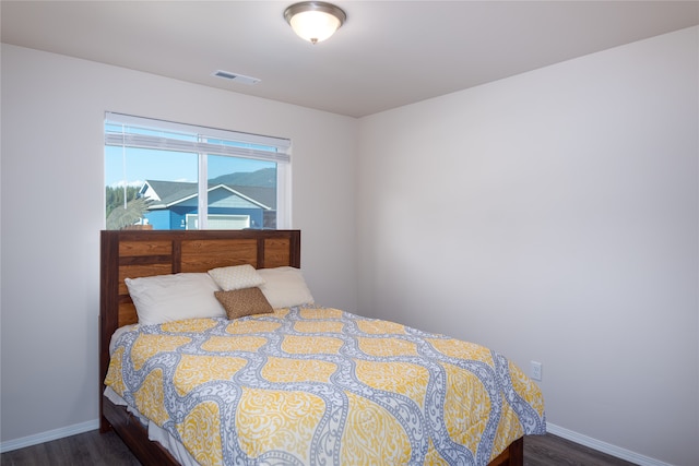 bedroom featuring dark wood-type flooring