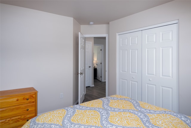 bedroom with a closet and hardwood / wood-style flooring