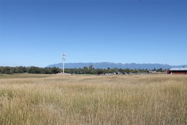 mountain view featuring a rural view