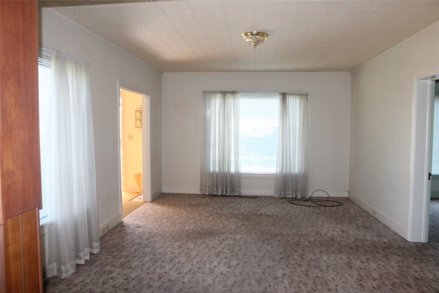 unfurnished room with carpet flooring