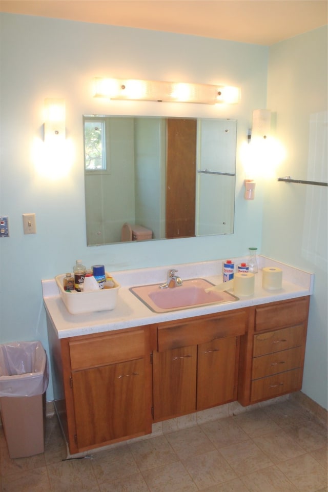 bathroom with tile patterned flooring and vanity