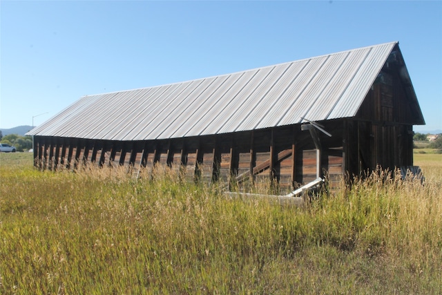 view of outdoor structure with a rural view