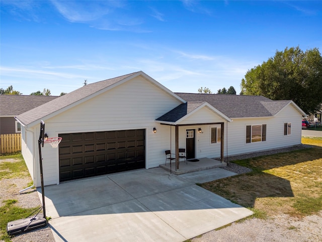 ranch-style house with a garage and a front lawn