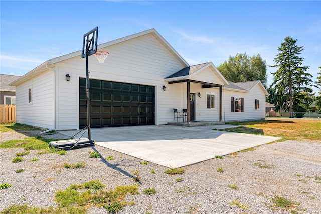 view of front of property with a garage and a front lawn