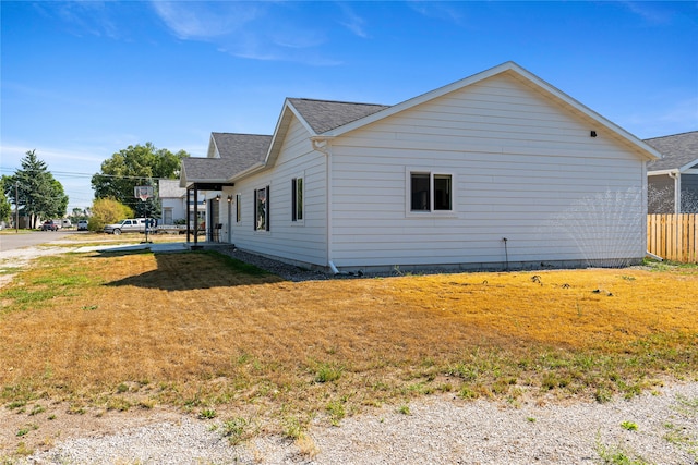 view of property exterior featuring a yard