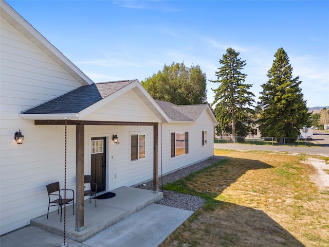 exterior space with a patio area and a yard