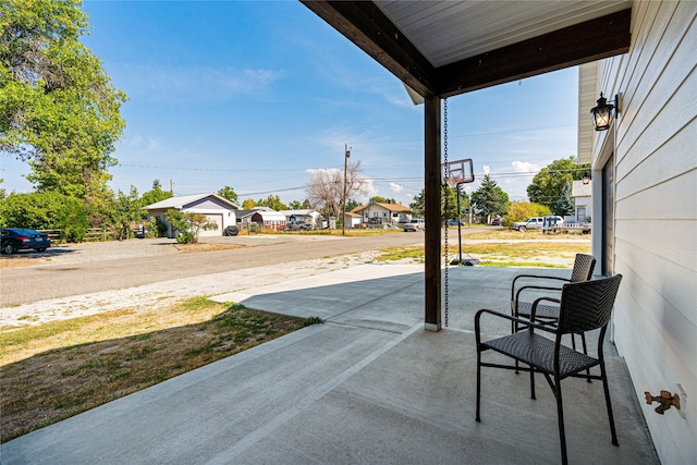 view of patio featuring a garage