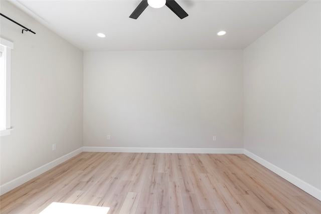 spare room with ceiling fan and light wood-type flooring